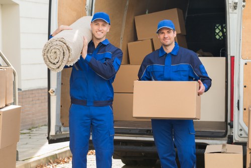 Professional movers carrying furniture during a Pimlico relocation