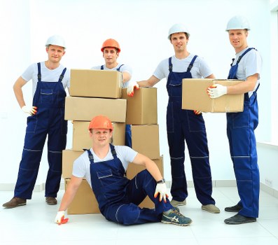 Moving supplies and wrapped furniture ready for a London flat move